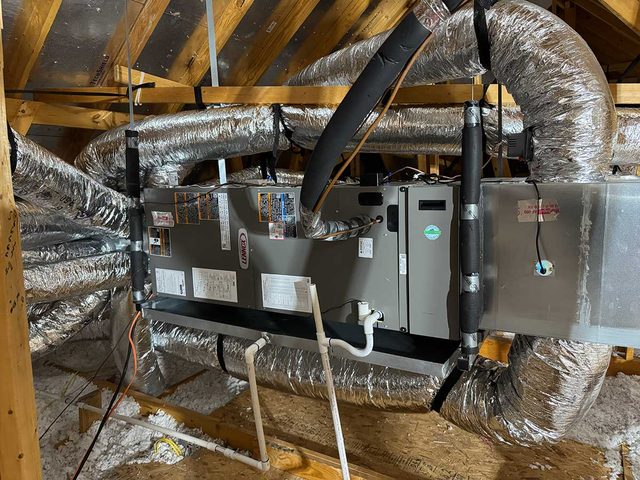 Two attic HVAC units installed with sealed insulated ductwork.